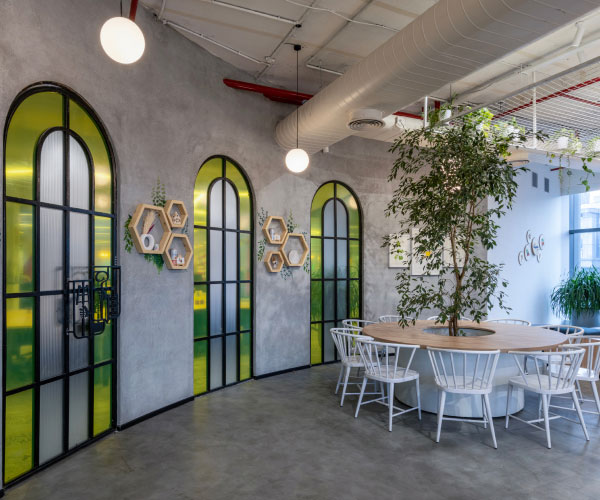 Project AB InBev: Modern office with sleek decor, open shelving, and a clean, professional atmosphere.